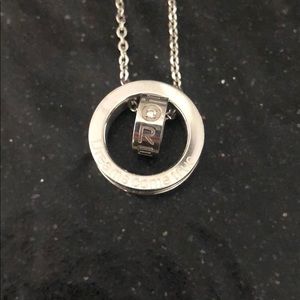 Silver necklace with engraved circular charms